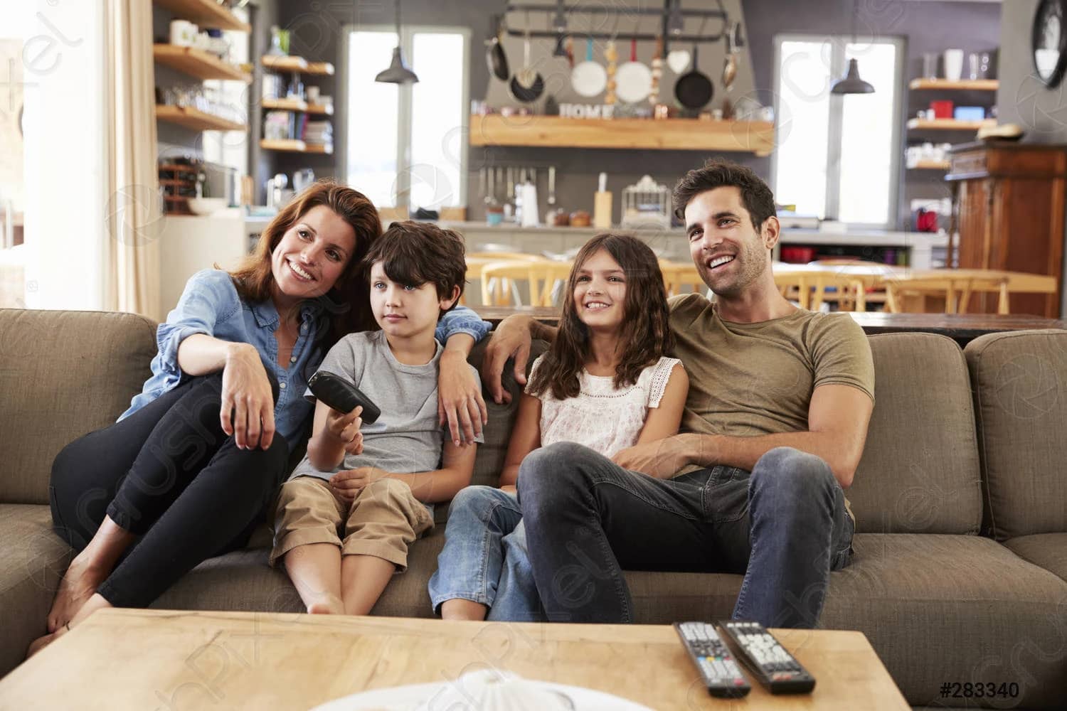 Family watching live TV at home with HolyIPTV